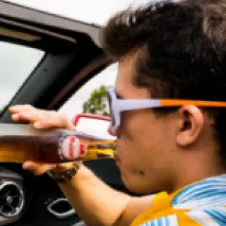 Person drinking and driving