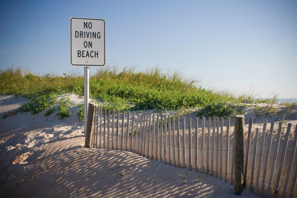 Beach with a sign that forbids driving