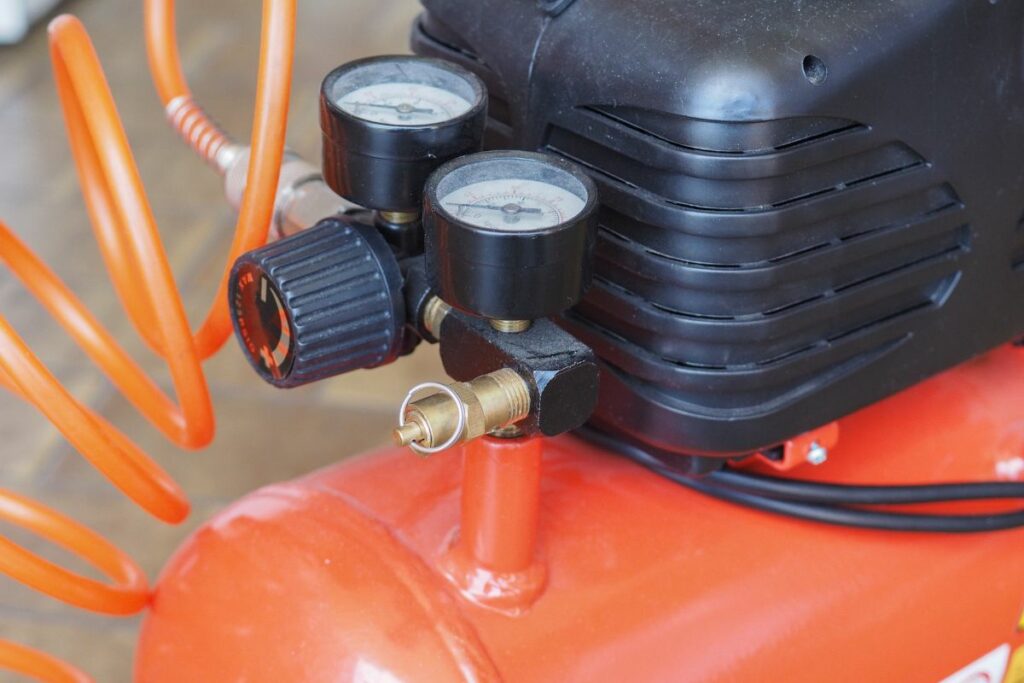 Air compressor with hose attached