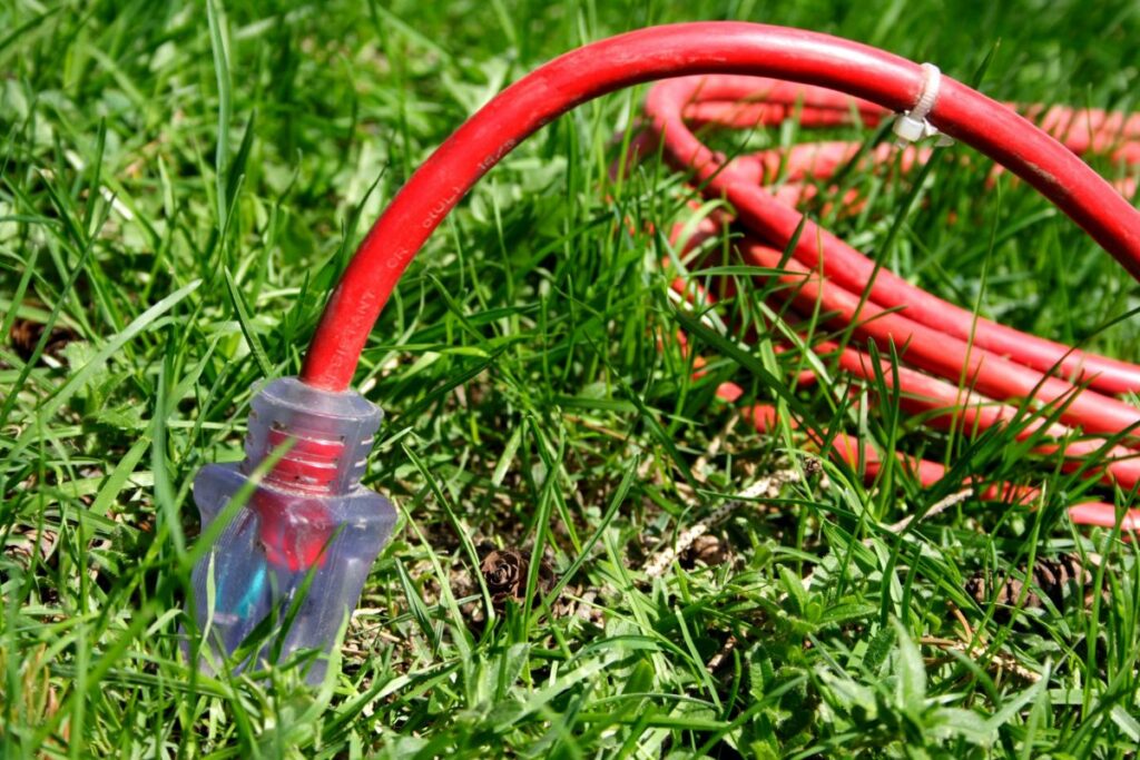 Extension cord laying in the grass